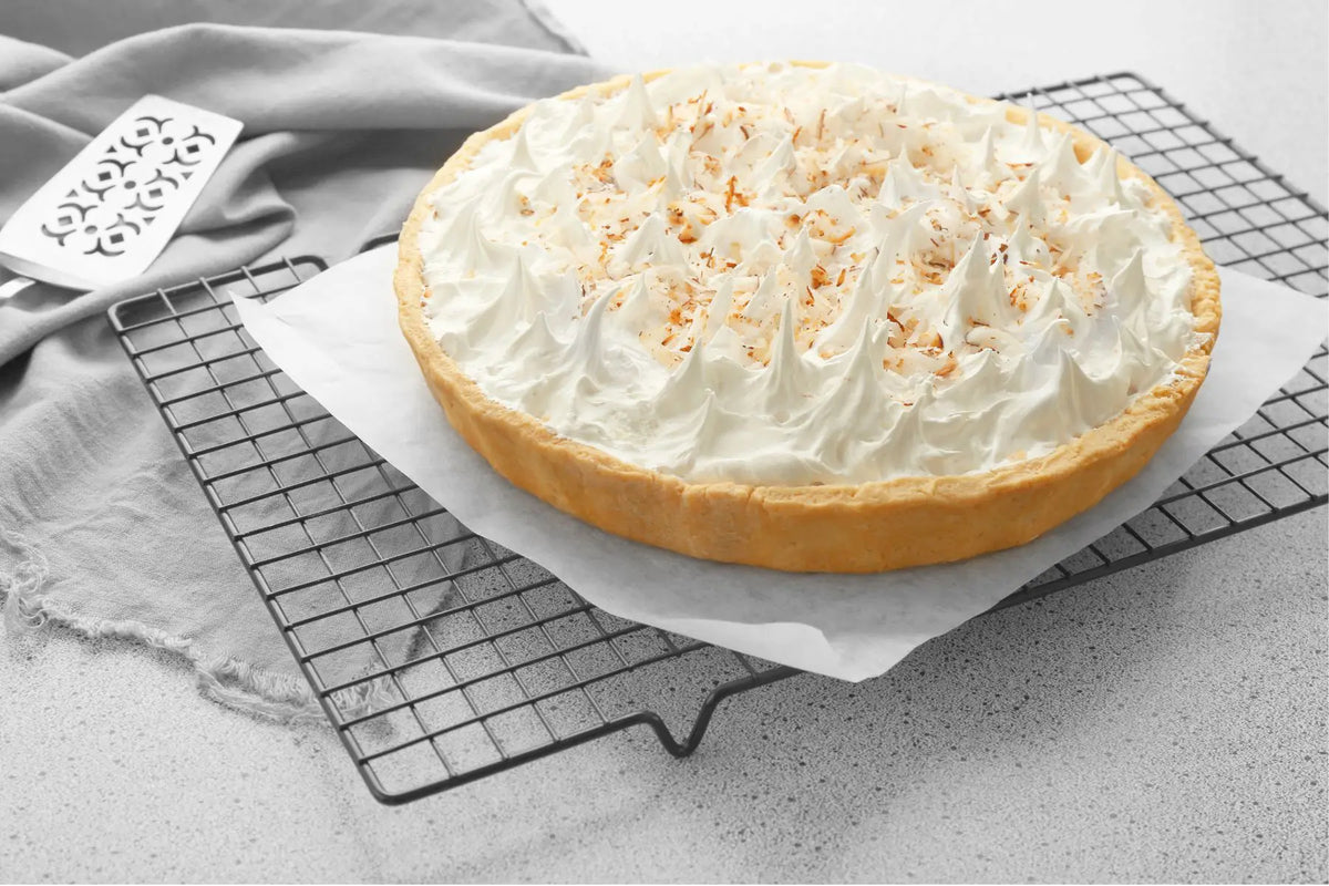 Coffee ice cream pie with whipped cream, hot fudge and walnuts