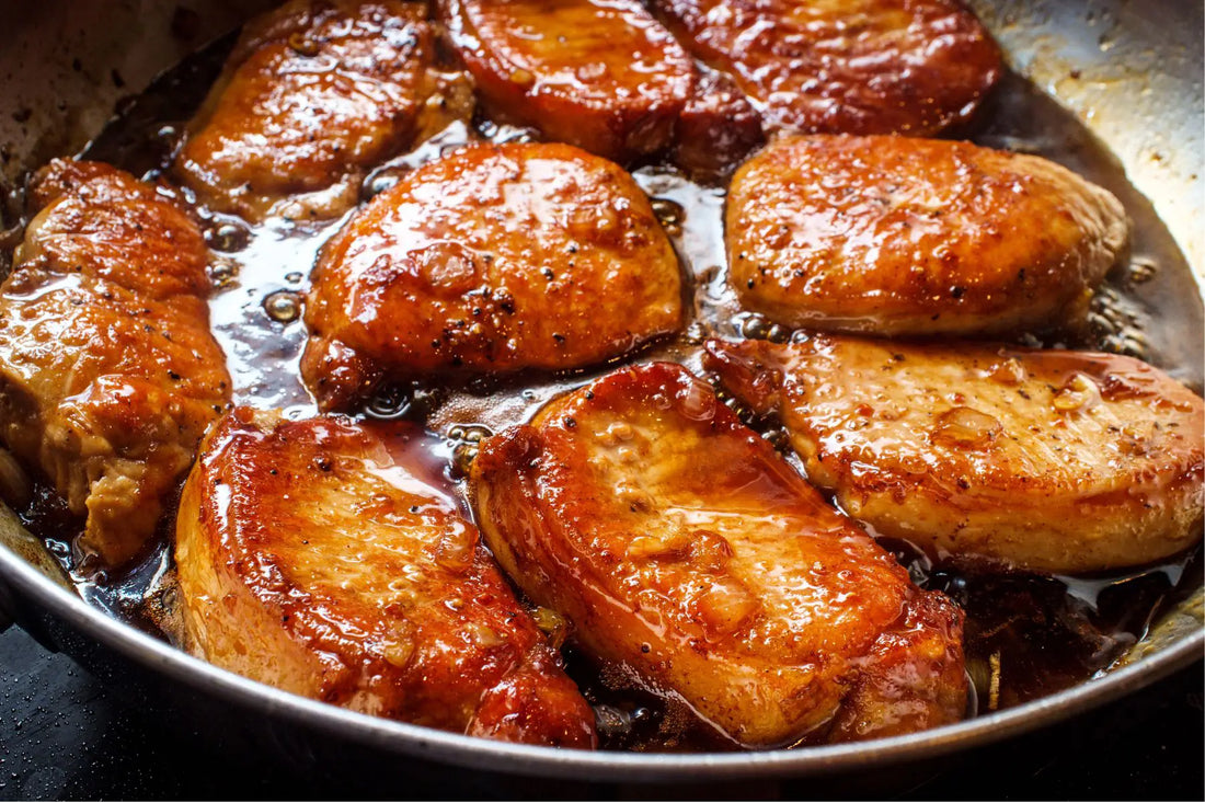 Grilled pork chops with molasses coffee glaze and fresh thyme