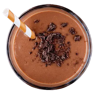 Chocolate smoothie with a straw in a glass bowl