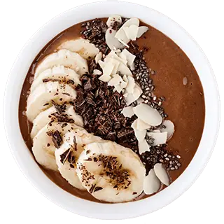 Chocolate smoothie bowl with banana slices, coconut flakes, and chia seeds.